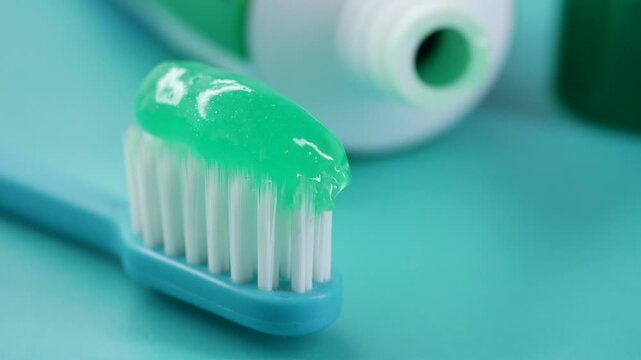 Brushing teeth with mint toothpaste at home