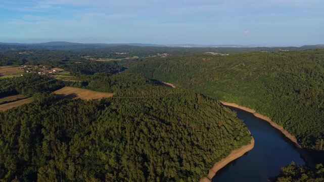 Forested Mountains Surround A Winding River Viewed From The Sopenas Viewpoint In Galicia, Spain. Aerial Shot