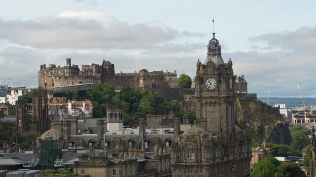 Edinburgh Castle seen from Calton Hill as clouds, birds and sunlight move