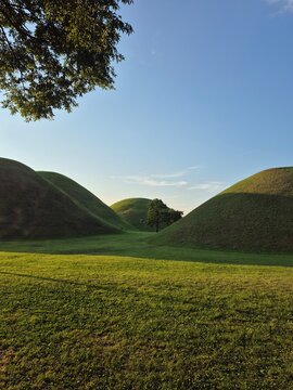 Ancient grass-covered burial mounds of Daereungwon Tomb Complex in Gyeongju, South Korea