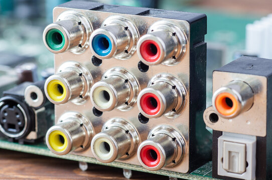 Close-up of colorful RCA audio and video connectors on a computer circuit board