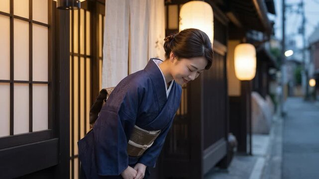 和服を着てお辞儀をする日本の女性