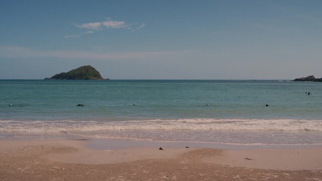 4K Scenic view of tropical ocean coastline and island with clear blue sky copy space.