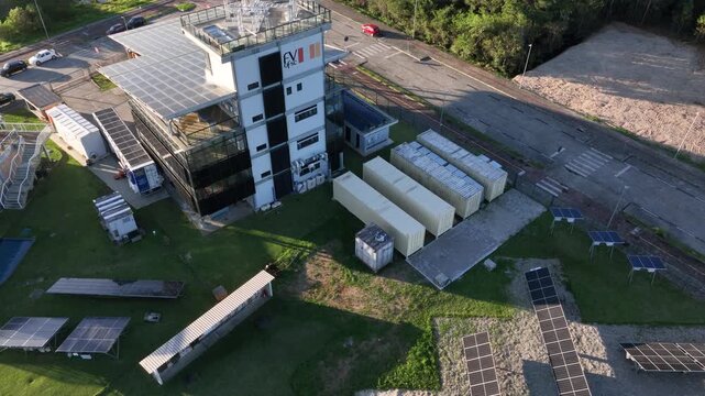 Solar Energy Technology Center with Rooftop Solar Panels, Ground-Mounted Arrays and Photovoltaic Research Systems in Florian&oacute;polis, Brazil. Aerial View.
