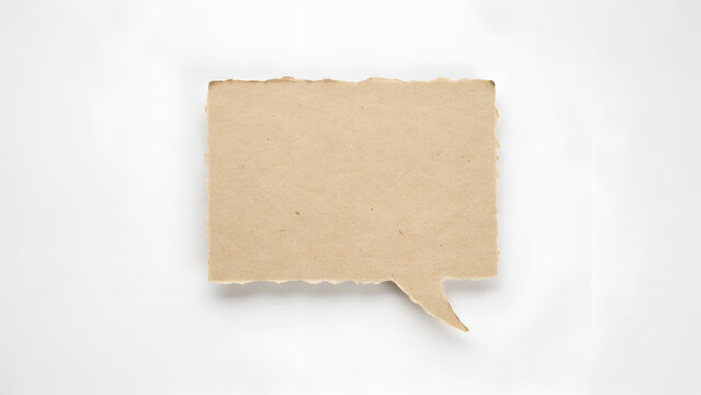A blank, rectangular speech bubble made of torn, textured brown craft paper isolated on a white background