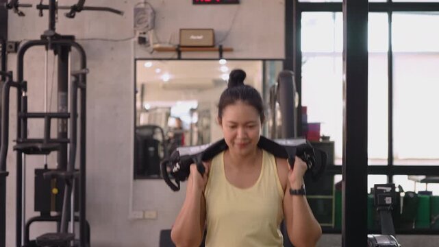 Hyrox race strong tough carry heavy effort HIIT indoor sport active asia people young Gen Z woman self care. High VO2 max cross power full core body muscle weight loss anti aging modern gym living.