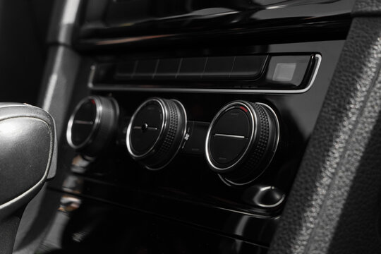 Automotive climate control and vehicle comfort, modern car interior dashboard with air conditioning adjustment knobs and temperature settings