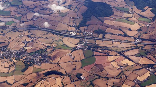 High Aerial View of M5 Motorway in England Surrounded by Browned Fields After Period of Drought in Summer 2026.