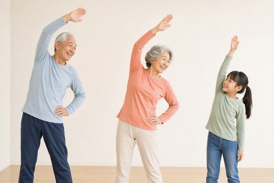 自宅で一緒にストレッチをする日本人の祖父母と孫娘