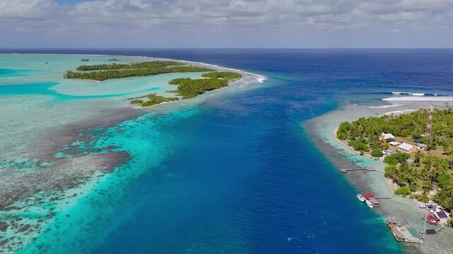 Aerial drone view over tropical atoll and blue lagoon for summer travel