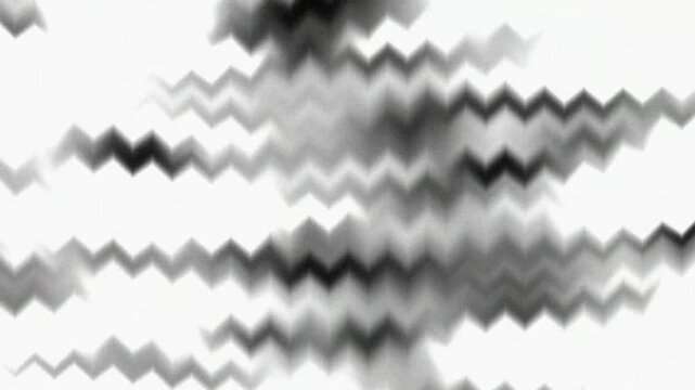 Abstract moving black and white zigzag pattern motion graphic background looping video clip with dynamic flowing stripes.