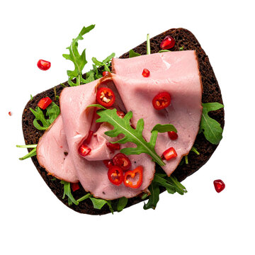 Open faced rye toast with sliced ham fresh arugula microgreens and crushed peppercorns for healthy breakfast menu design
