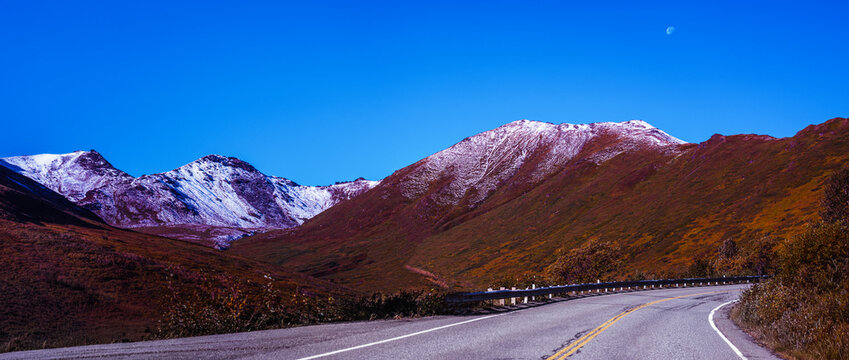 Palmer Alaska autumn landscape with moon over Independence Mine State Historical Park and Talkeetna Mountains