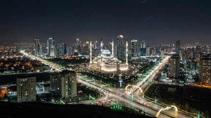 Fototapeta premium Grand mosque illuminated in night city skyline view.