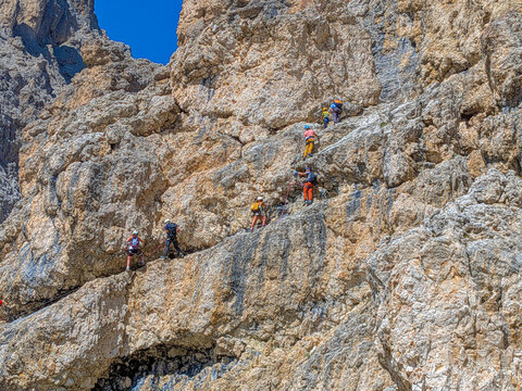 Group of climbers ascending Sassolungo mountain in South Tyrol, Italy