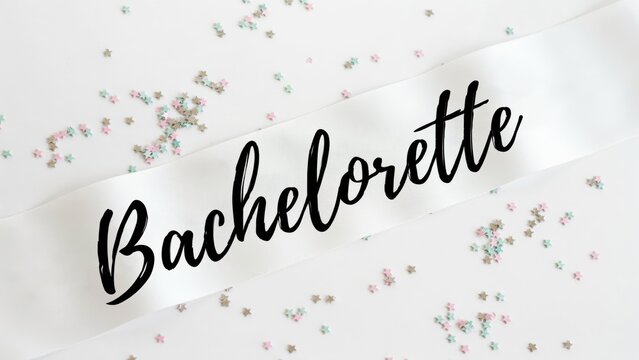 White bachelorette party sash with black text on white background with confetti. Perfect for wedding celebration social media content.