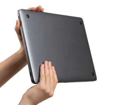 A pair of hands holding a closed grey metallic laptop against transparent background
