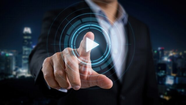 Business person touching a digital play button icon in a futuristic interface. Multimedia technology concept for online content strategy and corporate video marketing.