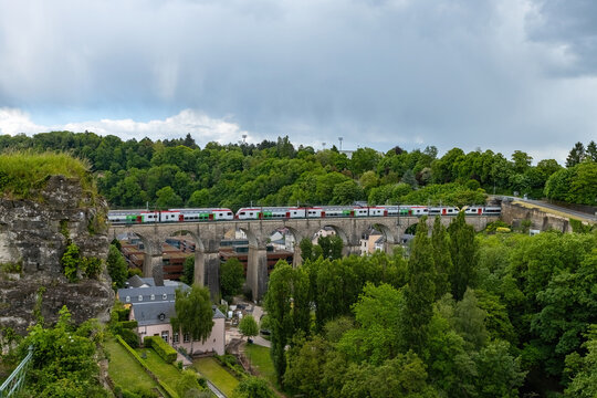 Train running ove the old stone bridge in Luxembourg city