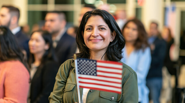 Naturalized citizen holding American flag while smiling among diverse adults at civic ceremony