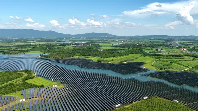 Floating solar photovoltaic power station on water surface with mountains in background