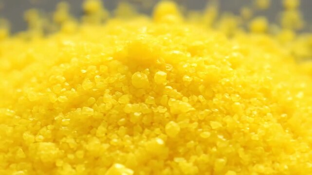 Close-up of cornmeal pellets, close-up of yellow pellet texture
