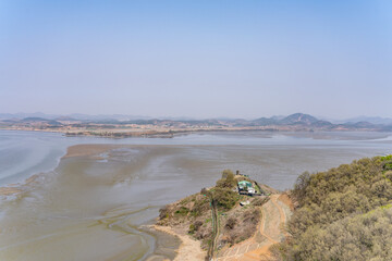 Obraz premium The confluence of the Han River and the Imjin River (Rimjin). North Korea is on the north side of the river. Odusan Unification Observatory, Paju city, Gyeonggi Province. Korean Demilitarized Zone. 