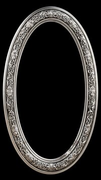Oval silver carved metallic picture frame on a