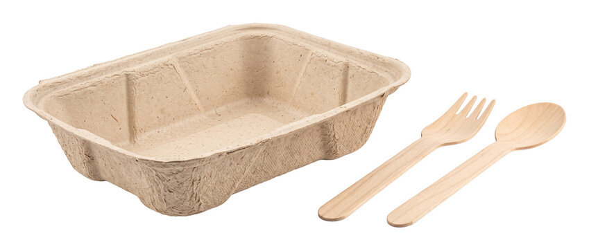 Biodegradable food container wooden cutlery set with eco friendly paper pulp takeout box and disposable spoon and fork isolated on black background for sustainable catering and zero waste packaging.
