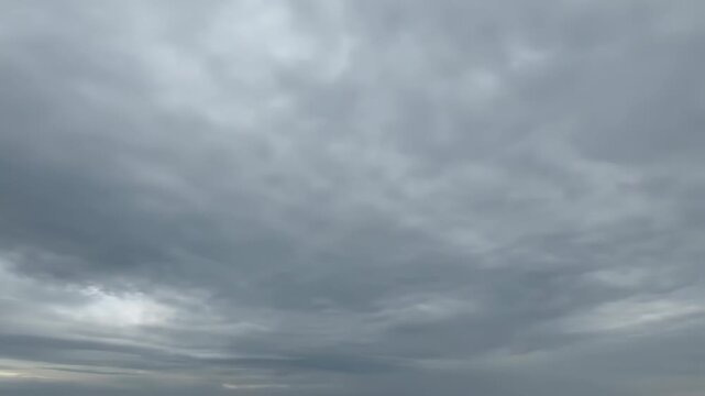 Gloomy sky with clouds, gray sky with flowing clouds
