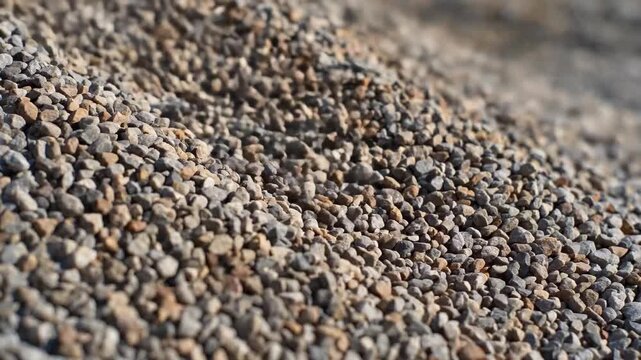 Close-up material of gravel pile, close-up of sand and gravel flow