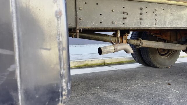 Underside Of A Heavy Truck Showing The Exhaust Pipe Assembly And Chassis Frame. Sideways Shot