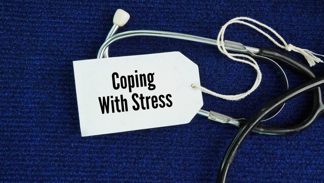 Stethoscope and paper tag with the words Coping with stress: You bounce back from setbacks and adapt to unexpected changes without falling apart.