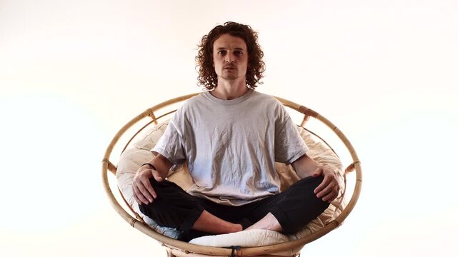 Full Body Man Meditating in Spiritual Mindfulness Pose on Circular Seat