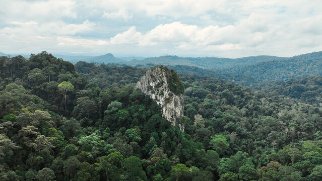 Aerial View of Batu Punggul Limestone Rock Formation and Tropical Forest in Nabawan, Sabah, Malaysia
