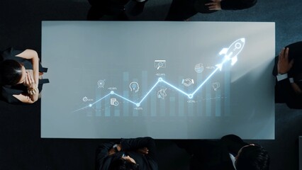 Business Team Analyzing Growth Metrics with Futuristic Graph and Digital Icons for Strategy...