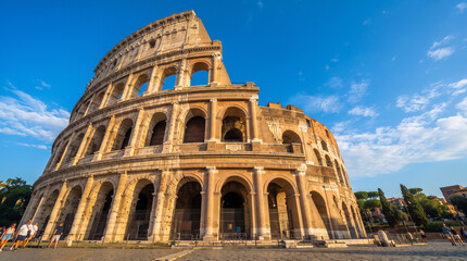 Fototapeta premium Majestic view of the Colosseum in Rome under a clear blue sky, Italy