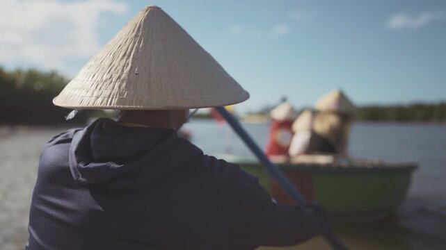 Travel in Asian, river cruise in Vietnam, people ride traditional coconut boats. Sightseeing and acquaintance with asian culture, visit Vietnamese city Hoi An, travel in asian region in summer