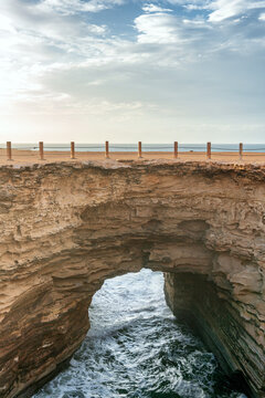 Trou Ajeb Lah natural sinkhole and arch in Morocco coast