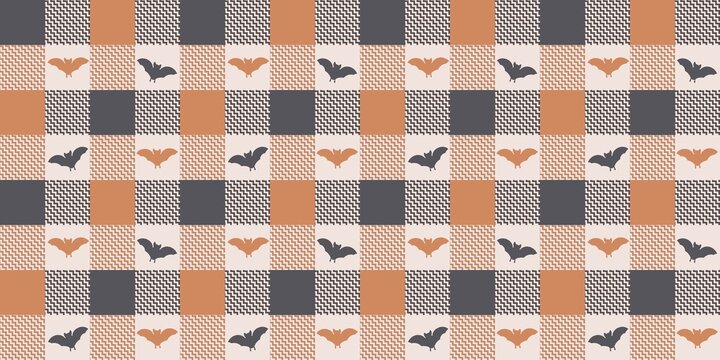 Halloween seamless pattern on checkered background. Spooky bats silhouettes in charcoal gray and orange on plaid and zigzag print. Cute festive texture for fabrics, wrapping paper, decor, scrapbook.
