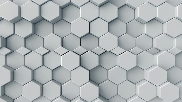 A 3D render displays a geometric pattern of interlocking hexagons in varying shades of gray.