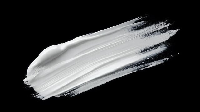 White cream swatches on black background