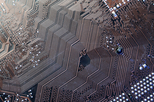 Highly dense geometric copper trace routing on a modern printed circuit board for advanced server data processing tech.