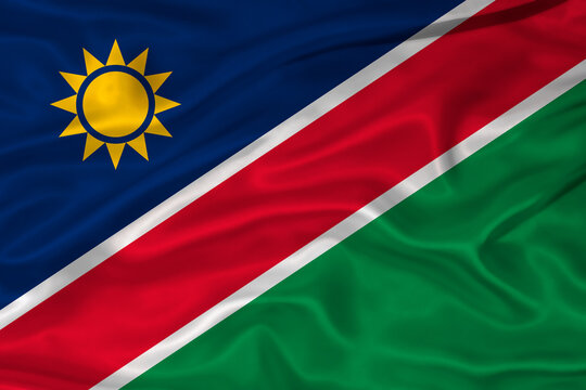 Flag of Namibia with a soft fabric texture. Namibian flag textured with fabric background