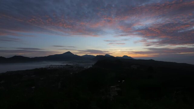 Sunrise over the Dieng Plateau with Mount Merapi, Sumbing, and Sindoro in Central Java, Indonesia