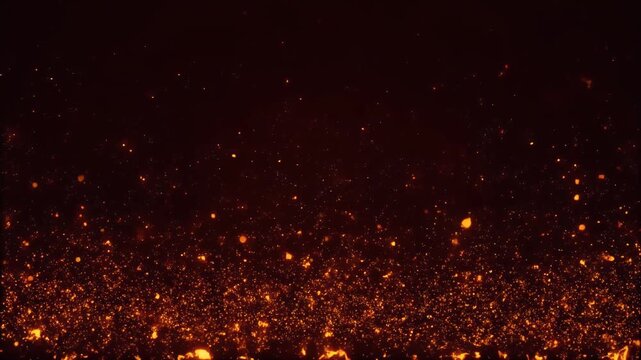 A dark background filled with numerous glowing orange particles.