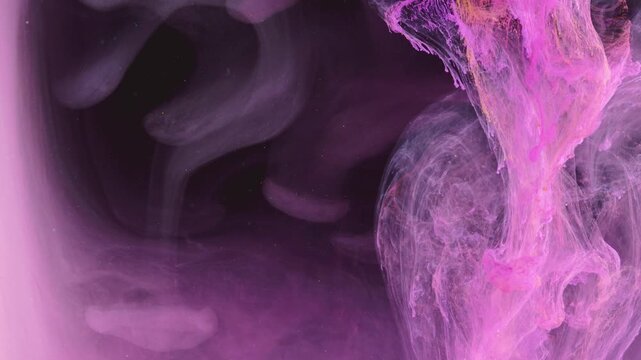 Close-up frontal view of concentrated magenta and pink ink column dispersing into deep black liquid, forming fibrous, veil-like plumes and delicate filament trails