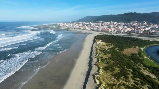 Aerial view over Vila Praia de &Acirc;ncora, northern Portugal, showing sandy beaches, ocean waves and the river meeting the Atlantic coastline.