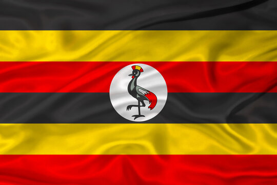 Flag of Uganda with a soft fabric texture. Ugandan flag textured with fabric background