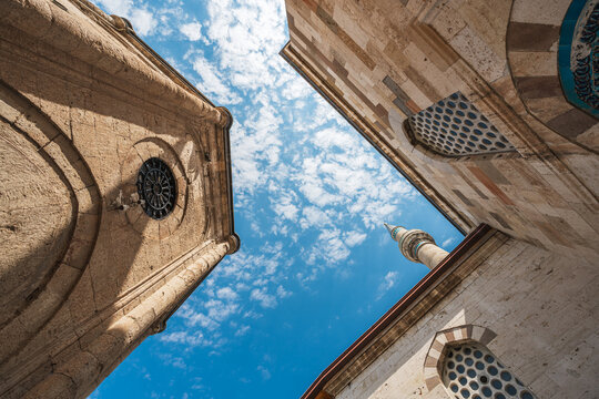 Looking up between historic buildings at Mevlana Museum in Konya Turkey